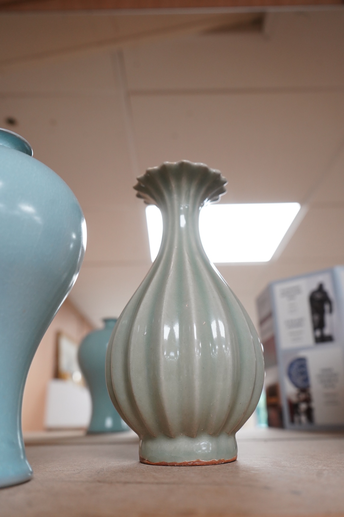 Two Chinese vases comprising a Meiping example and a celadon glazed example, largest 18cm high
